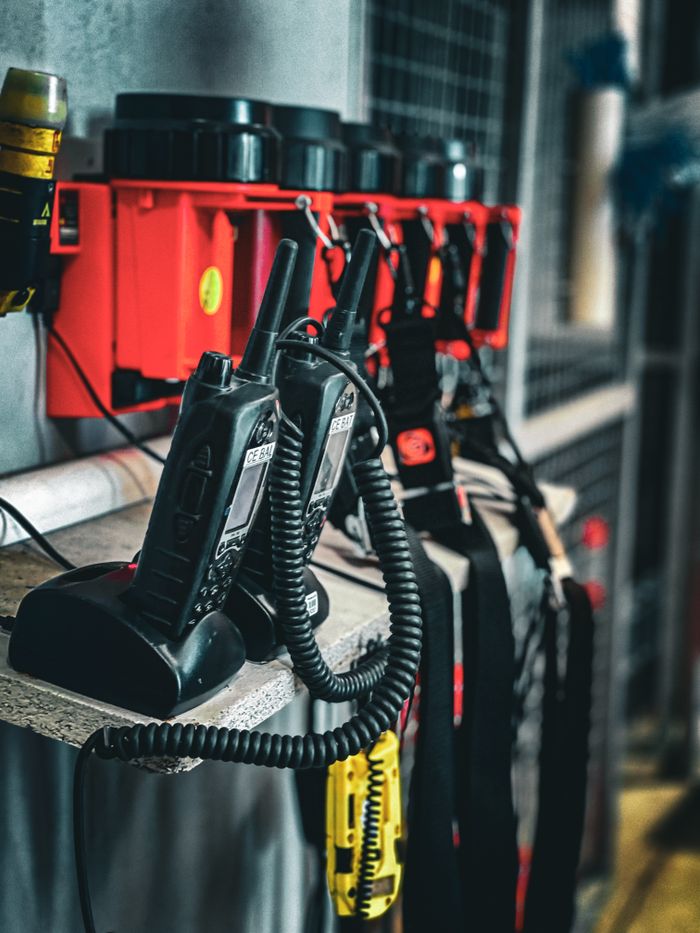 home-hero Close-up of communication radios and equipment in an industrial setting, showcasing organization and technology.